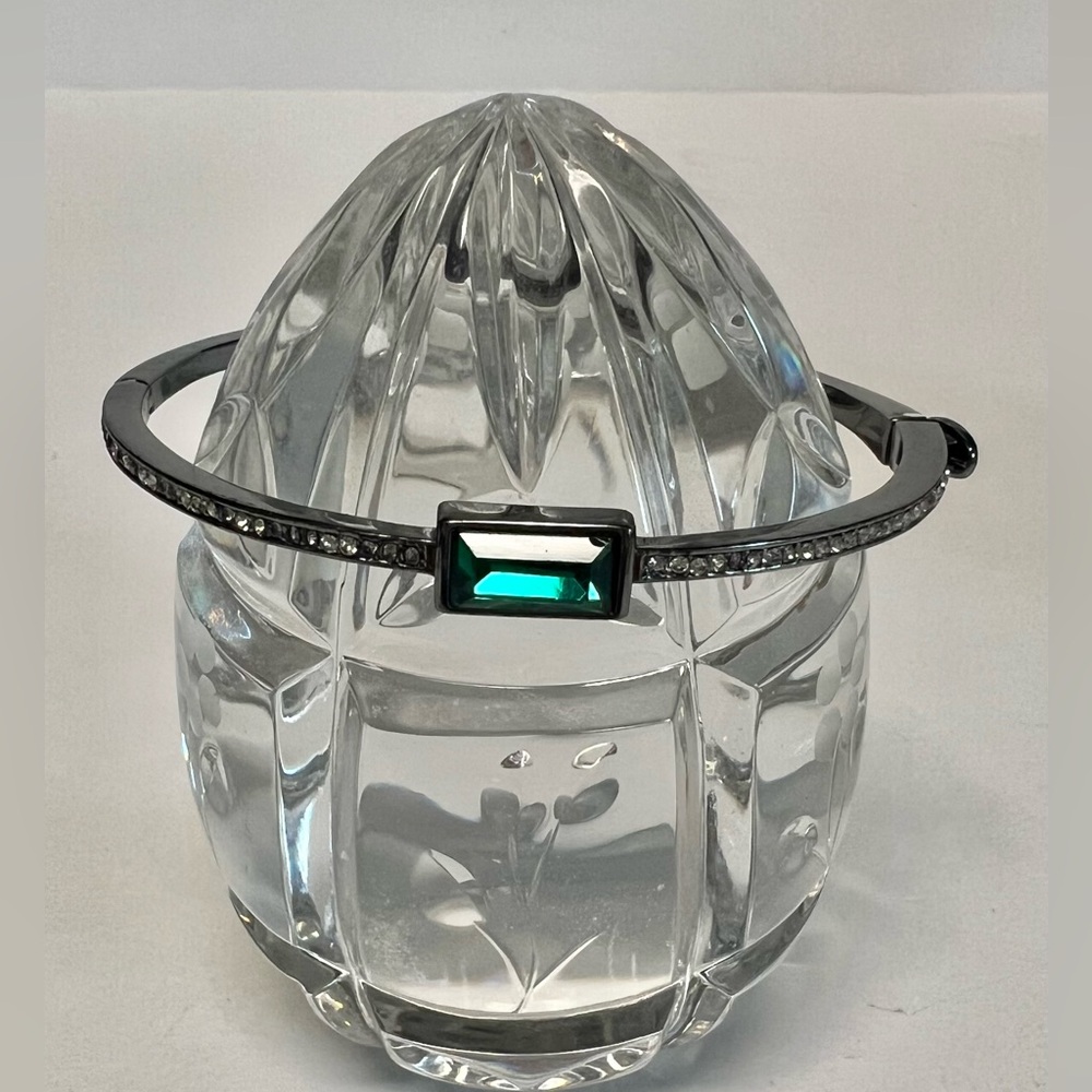 DKNY costume bracelet with center green stone.